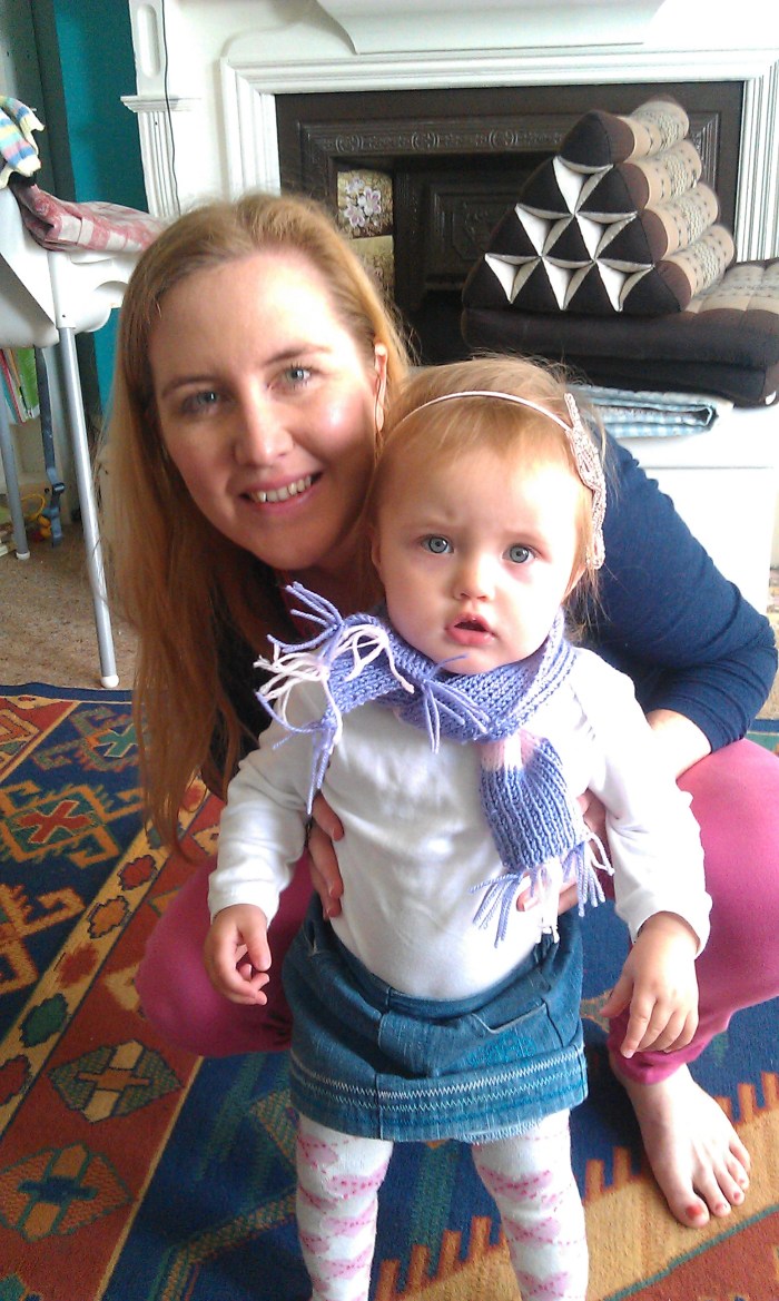 Tessa looking trendy in her scarf knitted by Nanny
